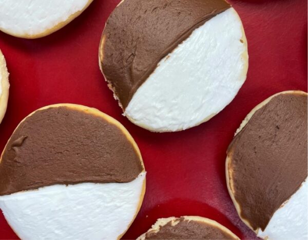 half moon cookie with chocolate and vanilla frosting